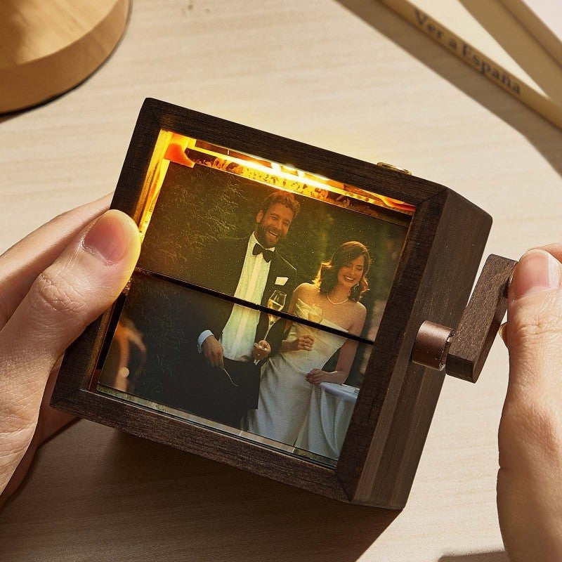 Wooden photo album with a couple's wedding photo on a wooden surface