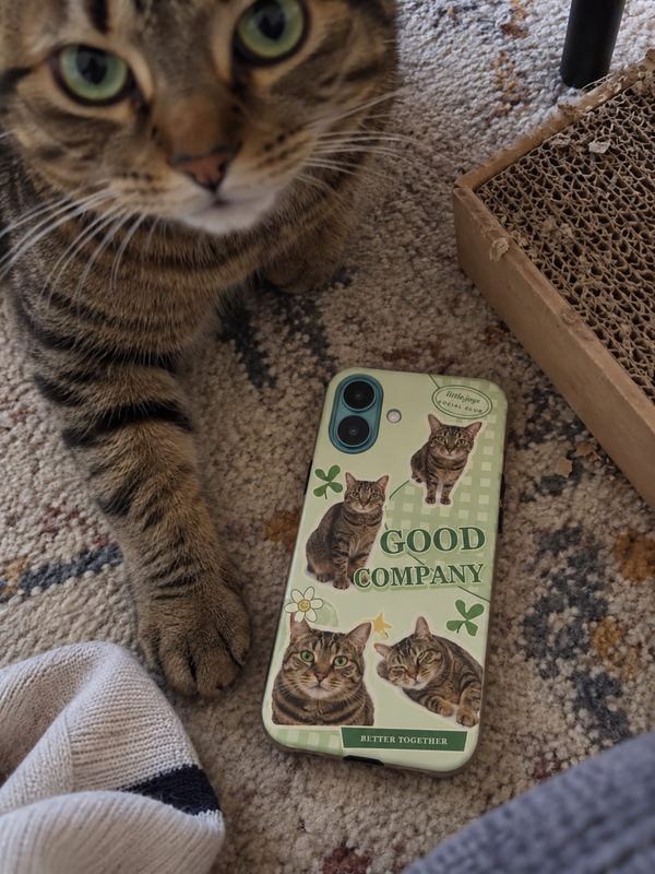 Pet collage phone case shown beside a brown mackerel tabby cat.
